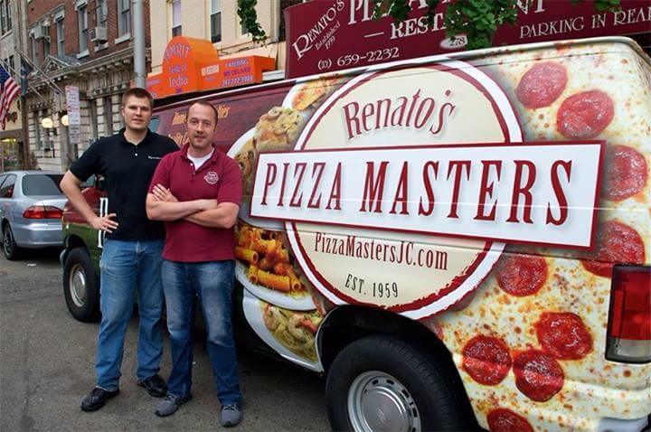DeMarchi Brothers possing in font of Renato's Pizza Master van which features a pizza and logo decal. Both brothers are smiling.